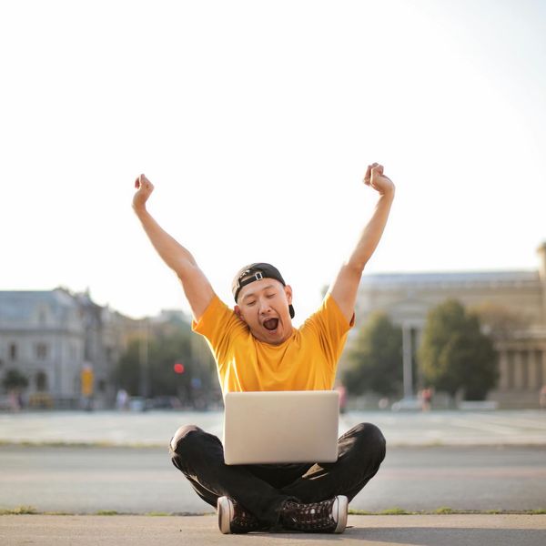 Person stretching in a bright, open space, symbolizing vitality and energy.